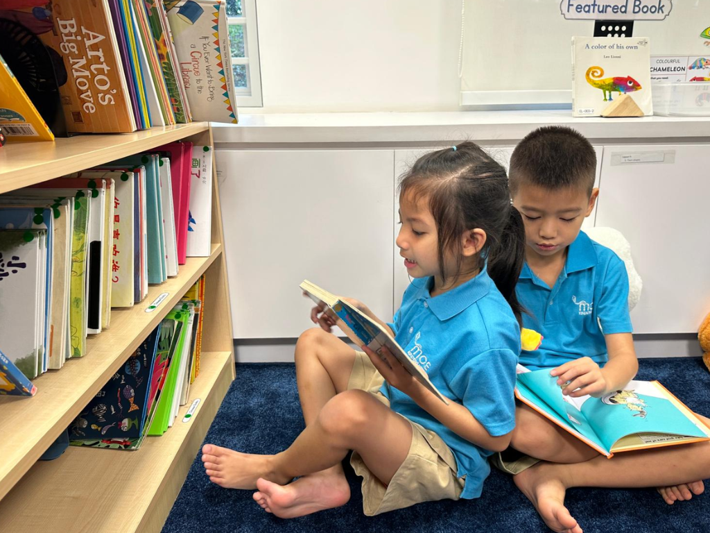 MOE Kindergarten children read independently at the classroom reading corner, exploring books from the MK Classroom Library.
